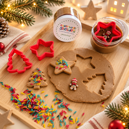 Knetset Weihnachten mit brauner Spielknete, Stern- und Tannenbaum-Ausstechern, bunten Reisstreuseln und Lebkuchenfigur für kreative Weihnachtsplätzchen.