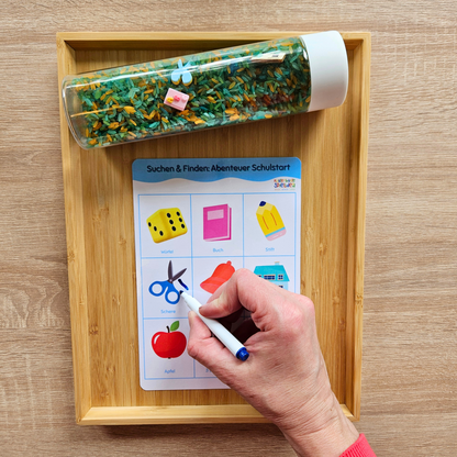 Montessori inspiriertes sensorisches Spiel: Sensorikflasche mit Suchbild, Schulsymbole im Reis finden und markieren